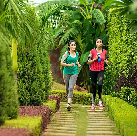 Lush greenery & vibrant flora at Birla Trimaya Pune, highlighting natural beauty & sustainable living offered by Birla Estates